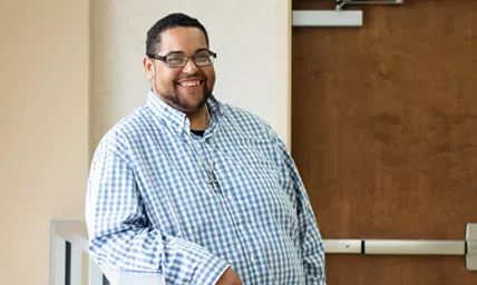 Man smiling at a Ballad Health nutritional facility